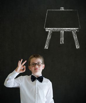 All ok or okay sign boy dressed up as business man with learn art chalk easel on blackboard background