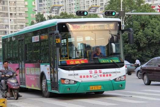 hybrid bus on the road in Kunming, Yunnan province, China