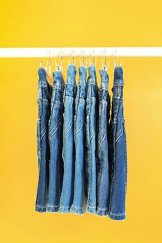 Row of hanged blue jeans