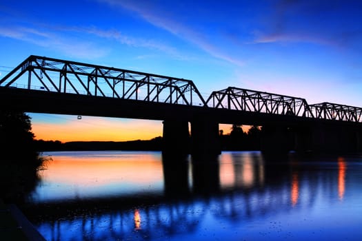 Victoria Bridge - Penrith, Australia at sunset.  This is a silhouette of the old box girder bridge crossing the Nepean river