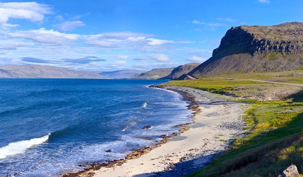 Landscape with low tide at Iceland ocean coast. Panorama.