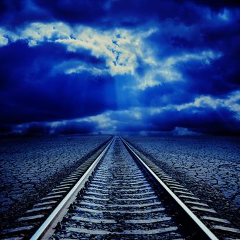 railroad in night to cloudy horizon