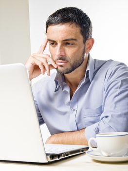 Young Man with Beard Working on Laptop isolated on a White Background