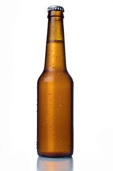 Cold frosted beer bottle on white background.
