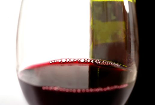 Close Up Glass of Red and Bottle  isolated on white background