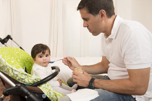 Father Feeding his cute Lovely Baby Girl 