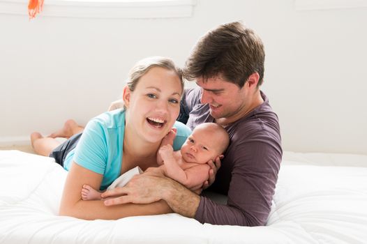 happy parents with their newborn baby boy.