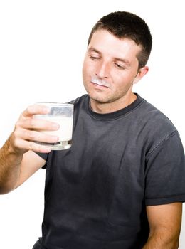 Healthy Young  Man drinking a Glass of Milk isolated on White Background