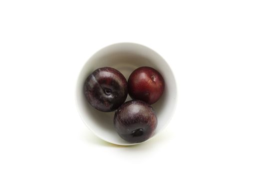 Fresh Dark Plums in Bowl