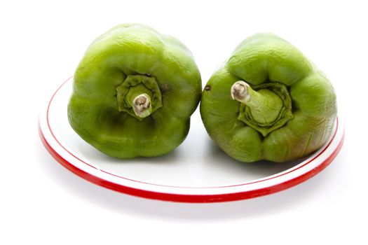 Fresh Green Capsicum on Plastic Plate