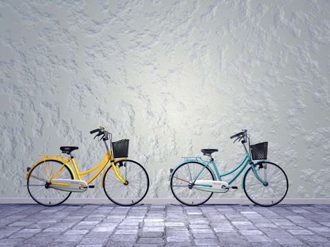 Beautiful green and yellow city bikess in the street against a wall