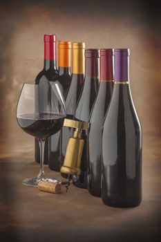 wine bottles, glass and corkscrew on an old master's canvas background