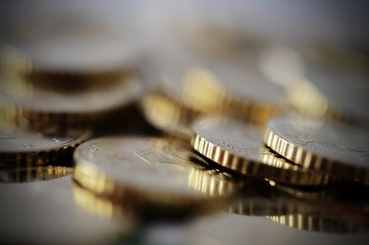 Macro euro coins piled isolated shallow depth of field