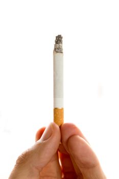 Male hand holding a cigarette on white background
