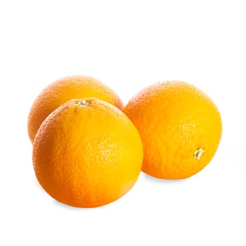 Three whole oranges isolated on white background