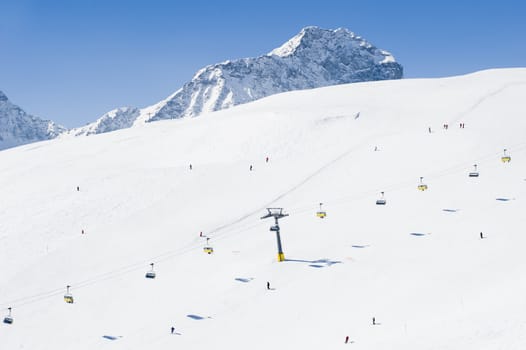 Skiers enjoying a sunny day in the mountain