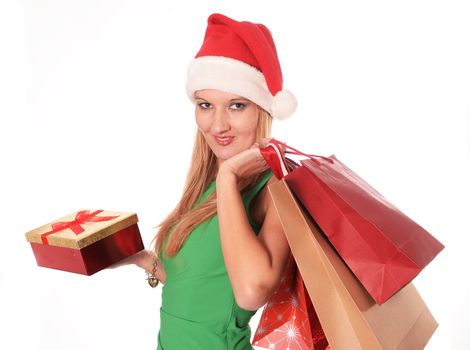 Young beautiful woman Christmas shopping bags and chic green dress