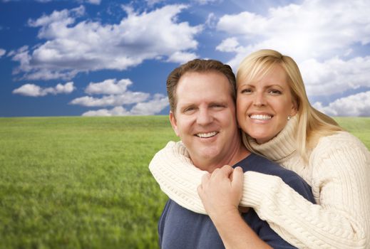 Portrait of A Happy Attractive Couple Hugging at the Park.