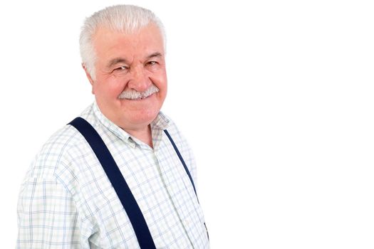 Charismatic friendly senior man wearing braces looking at the camera with a wide friendly smile, upper body isolated on white