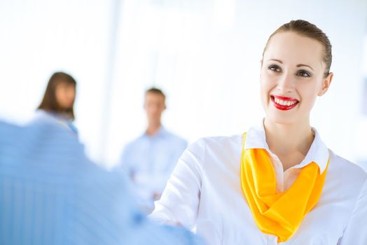 young business woman shaking hands with a client, the agreement between the partners