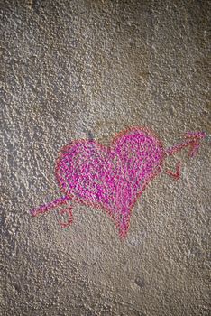 Heart grafitti on a grunge  old concrete wall