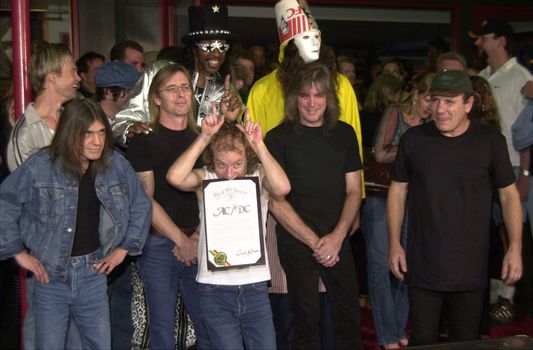 Cliff Williams, Brian Johnson, Angus Young, Malcolm Young at the ceremony where they were inducted into Sunset Blvd's Rockwalk. 09-15-00