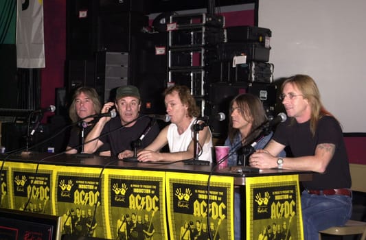 Cliff Williams, Brian Johnson, Angus Young, Malcolm Young, Phil Rudd at the ceremony where they were inducted into Sunset Blvd's Rockwalk. 09-15-00