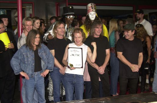Cliff Williams, Brian Johnson, Angus Young, Malcolm Young at the ceremony where they were inducted into Sunset Blvd's Rockwalk. 09-15-00