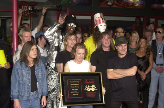 Cliff Williams, Brian Johnson, Angus Young, Malcolm Young at the ceremony where they were inducted into Sunset Blvd's Rockwalk. 09-15-00