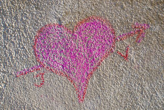 Heart grafitti on a grunge  old concrete wall