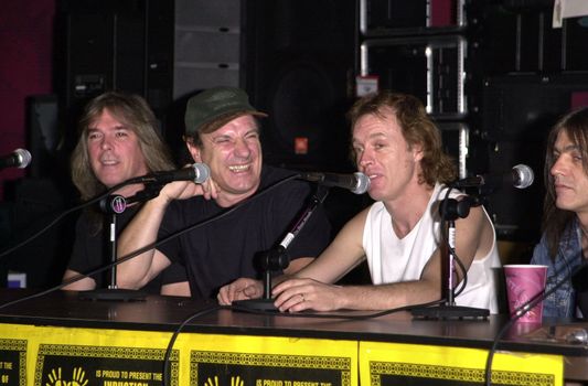 Cliff Williams, Brian Johnson, Angus Young, Malcolm Young at the ceremony where they were inducted into Sunset Blvd's Rockwalk. 09-15-00