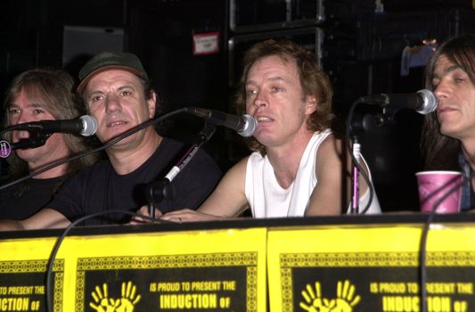 Cliff Williams, Brian Johnson, Angus Young, Malcolm Young at the ceremony where they were inducted into Sunset Blvd's Rockwalk. 09-15-00