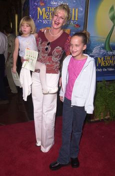 Melanie Griffith with daughters Dakota and Stella at the premiere of Disney's "Little Mermaid 2" in Hollywood, 09-16-00