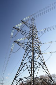 Large electricity power pylon supplying the UK with its energy needs through the National Grid.