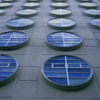 Modern circular windows on concrete structure