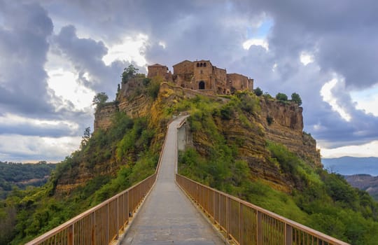 Civita di Bagnoregio, abandoned village town accessed only by elevated foot bridge, south Tuscany, Italy