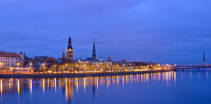 Christmas evening riverside view of old city of Riga, Latvia.