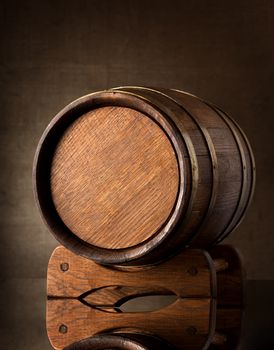 Old wooden barrel on a brown background