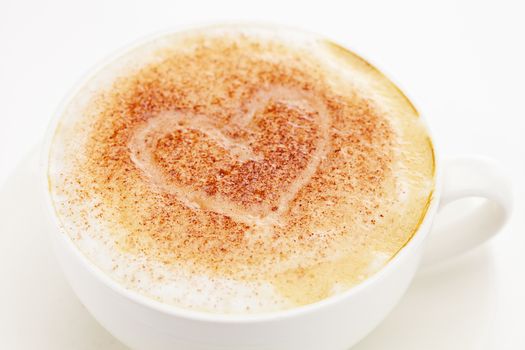 cappuccino in a cup in the shape of hearts
