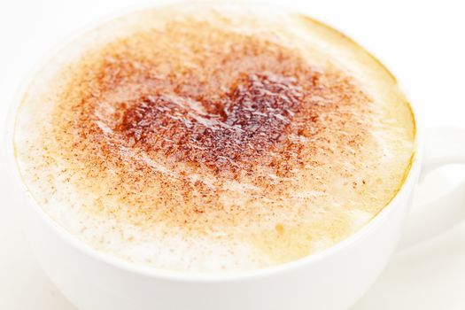 cappuccino in a cup in the shape of hearts