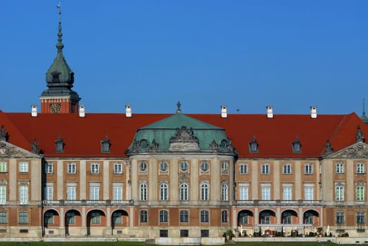 Close up of the Royal Palace facade in Warsaw. Early morning view from riverside.