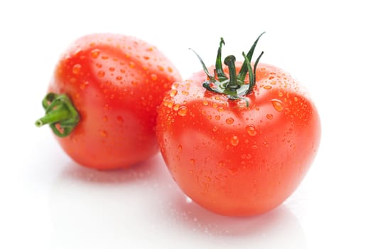 tomato with water drops isolated on white