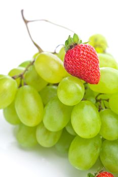 bunch of white grapes and strawberries isolated on white