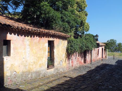 The Calle de Los Suspiros (Street of Sighs) in Colonia del Sacramento is a Portuguese street with its original cobbled surface and central drain. The houses seen here date back to the first colonial period.
