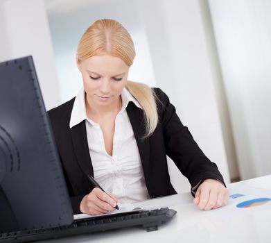 Successful young businesswoman working in the office