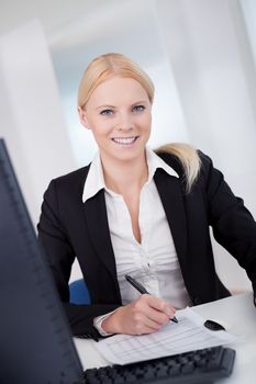 Successful young businesswoman working in the office