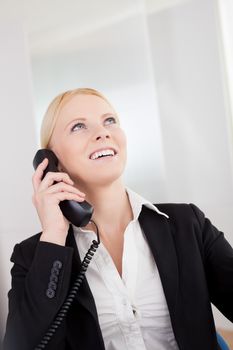 Beautiful businesswomen talking on the phone in the office