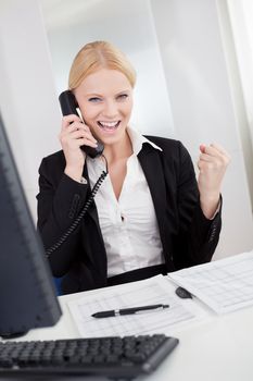 Beautiful businesswomen talking on the phone in the office