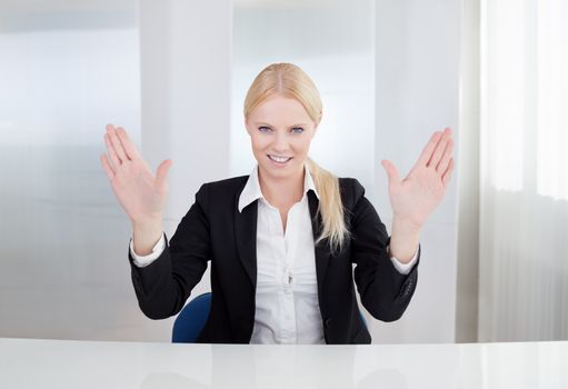 Beautiful businesswoman touching the screen with her finger