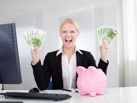 Businesswoman holding euro currency notes in the office